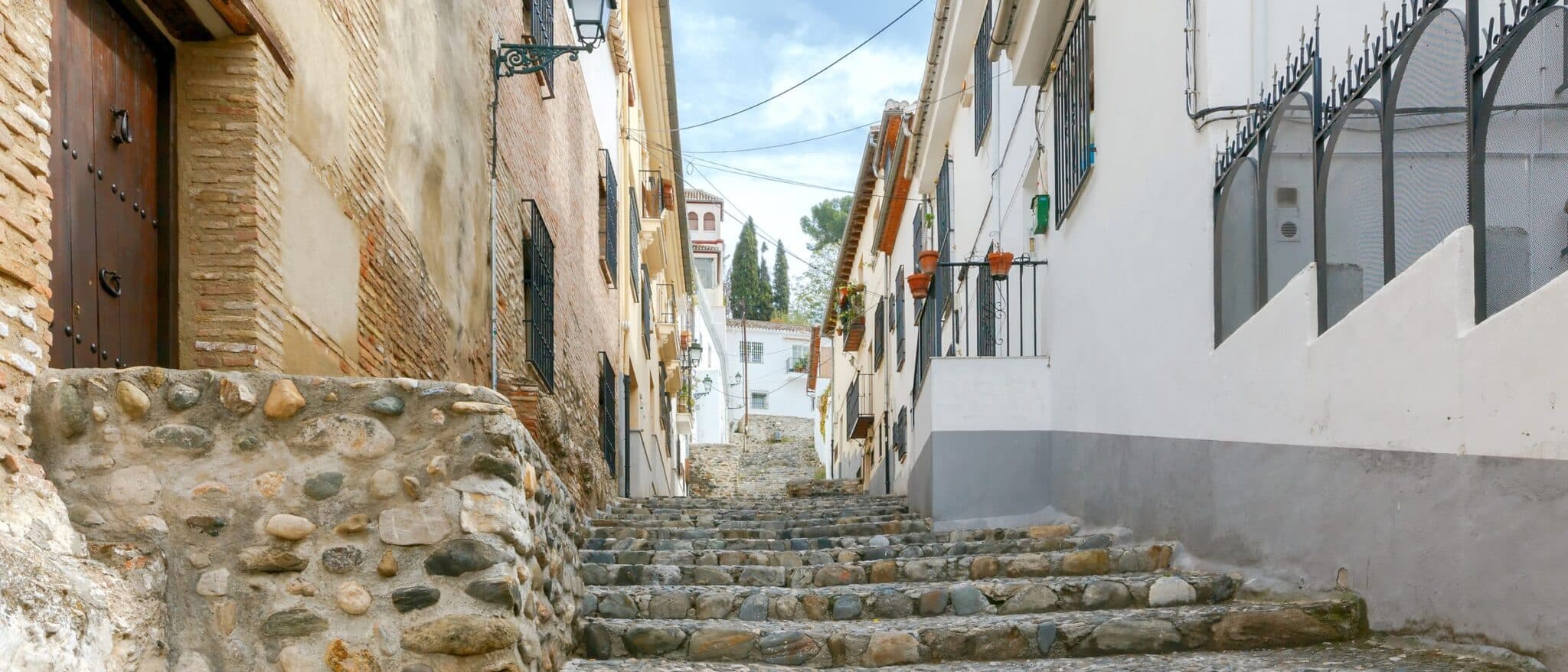 A stepped medieval street in the Albaicín quarter of Granada