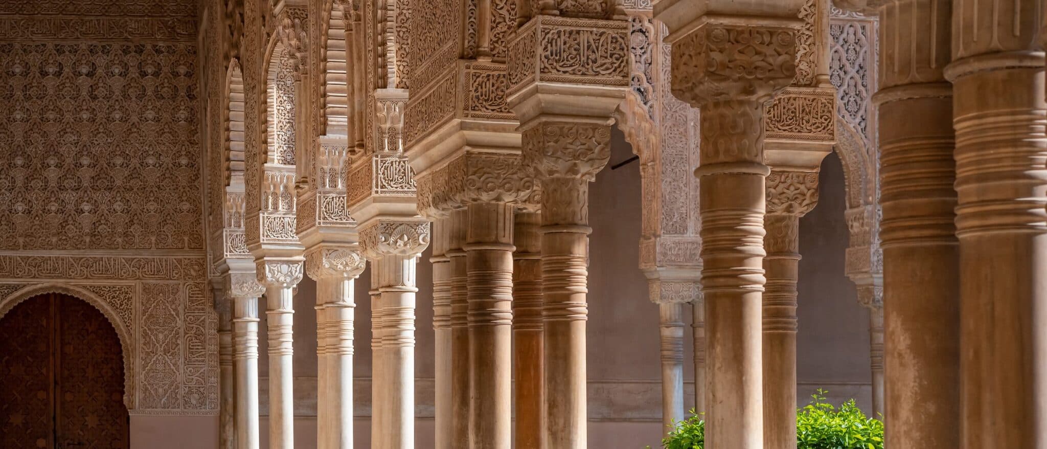 Moorish arches and carved columns inside the Alhambra, Granada