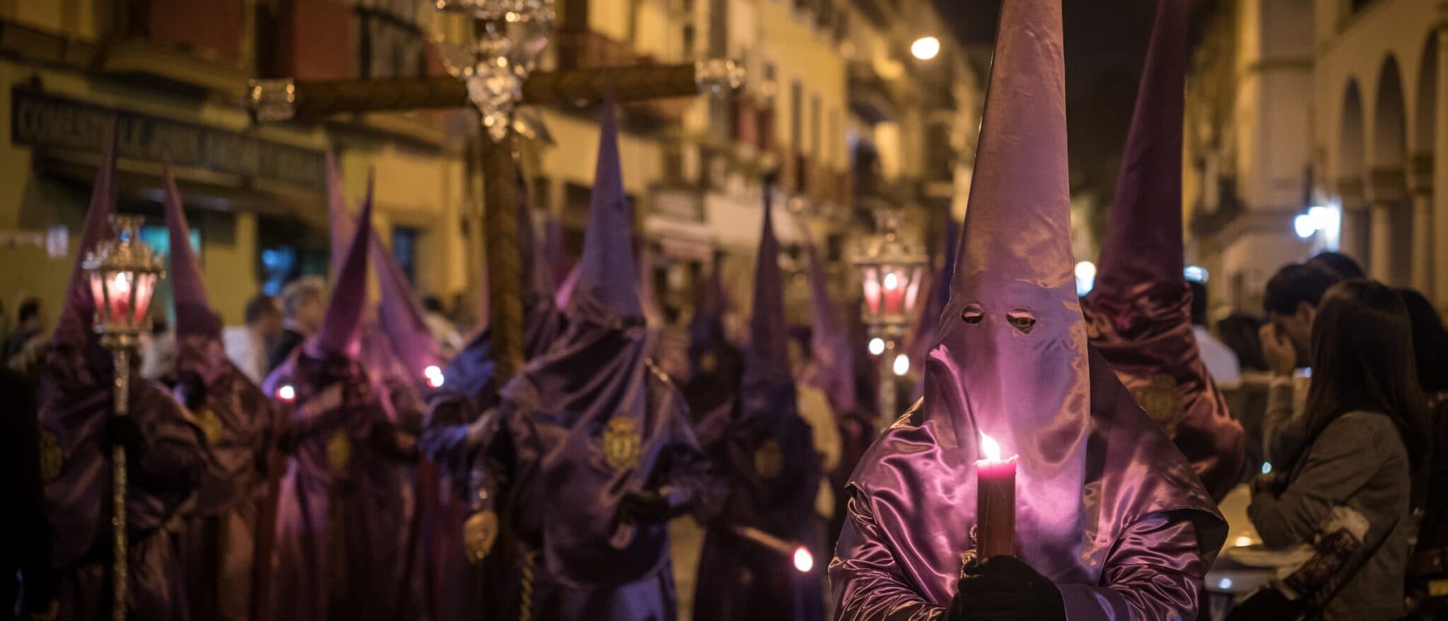 Nazarenos in pointed hoods during a Semana Santa procession