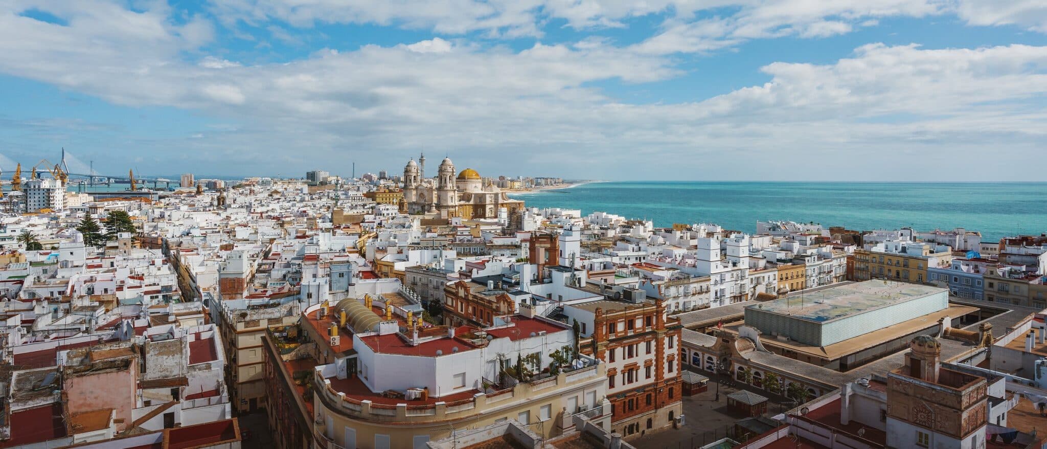 Cádiz from above — the old town packed onto its spit of land, the cathedral dome and the Atlantic beyond