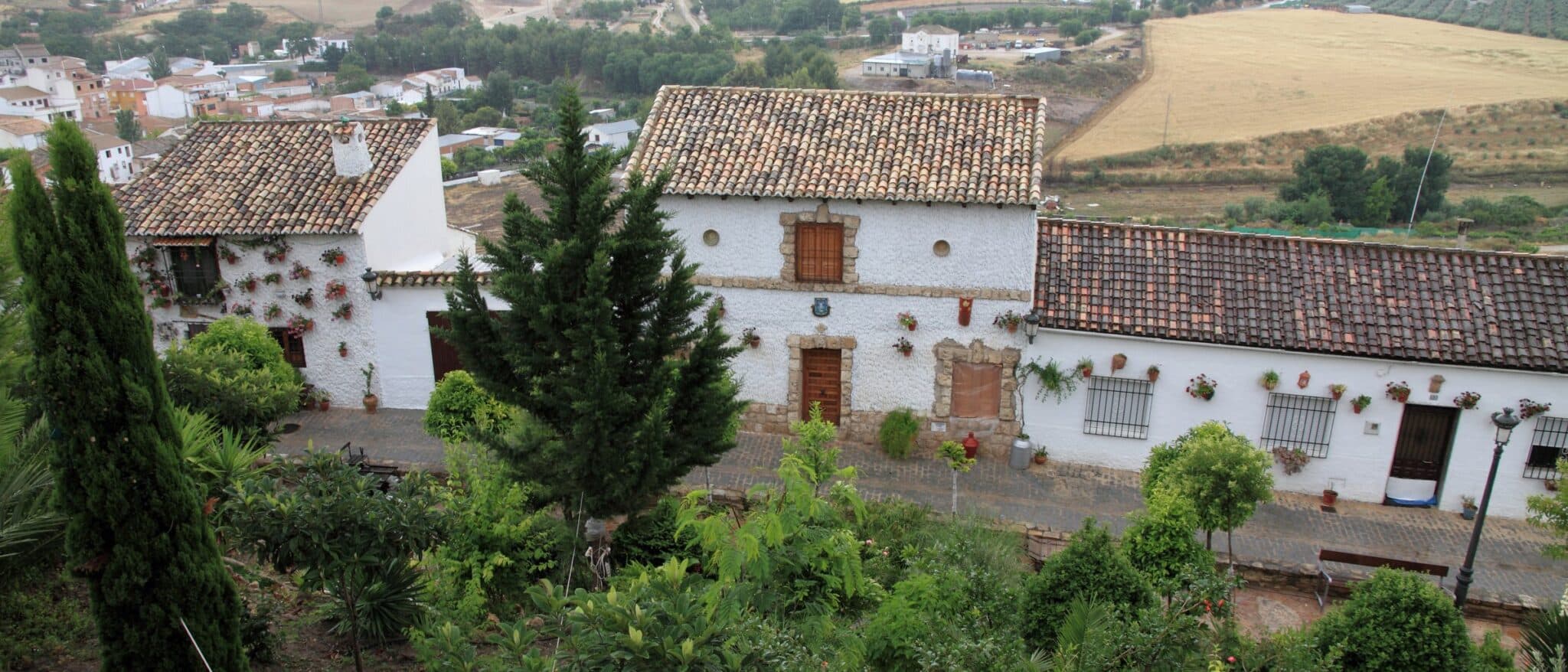 Peal de Becerro in Jaén province, white houses with olive groves on the hills behind