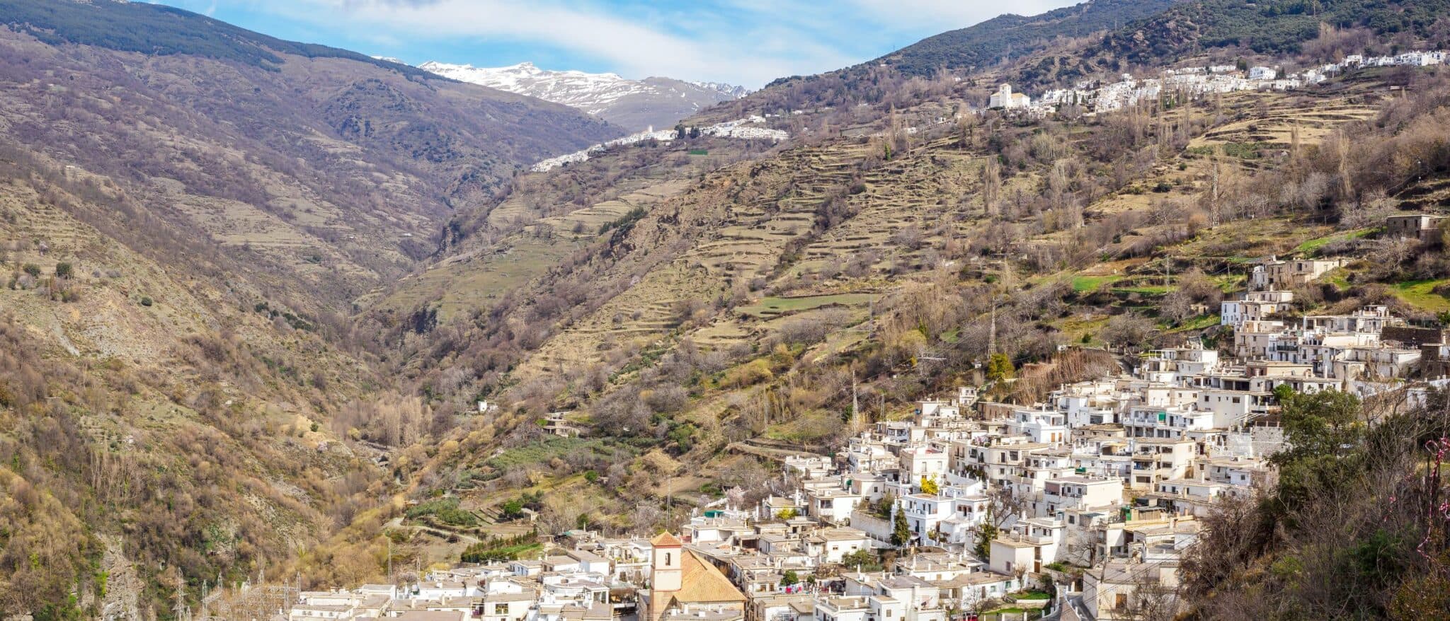 Pampaneira in the Poqueira gorge of the Alpujarra, with Bubión and Capileira above and the Sierra Nevada behind
