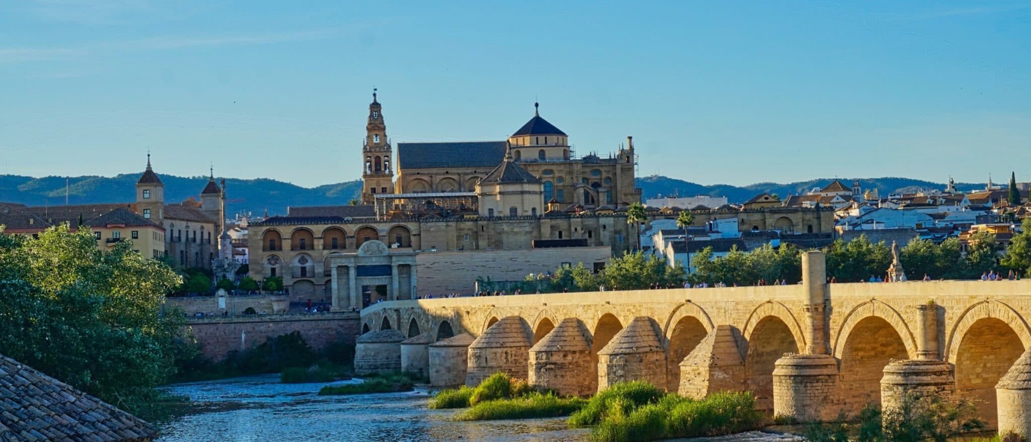 The Mezquita of Córdoba seen across the Roman bridge over the Guadalquivir