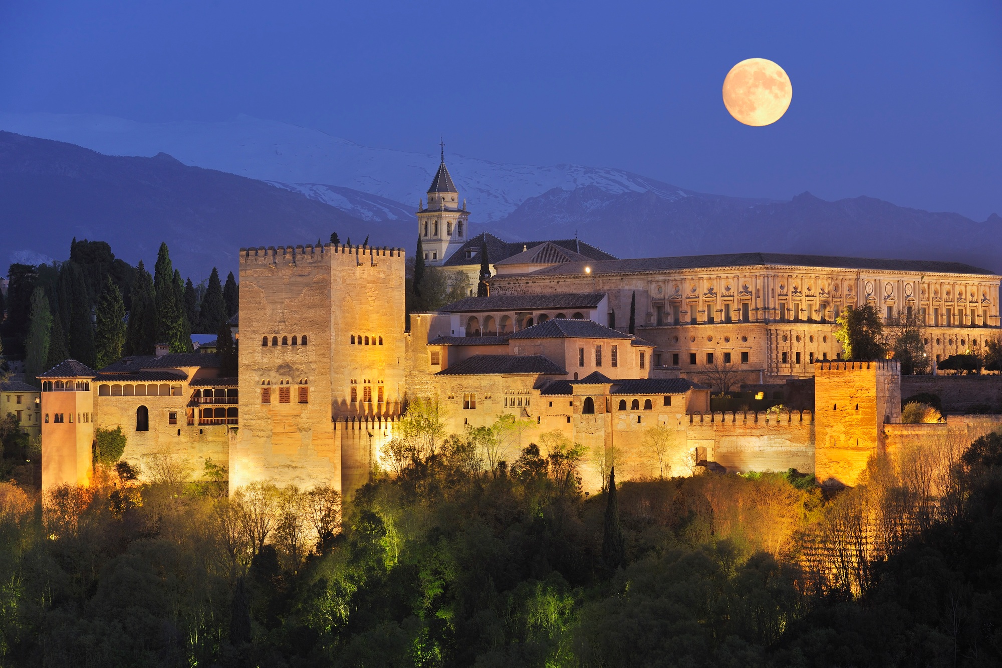 Spain, Andalusia, Granada Province, View of Alhambra Palace illuminated at night