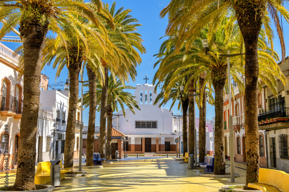 Huelva, Andalusia, Spain - Palm trees and historic architecture in the city center
