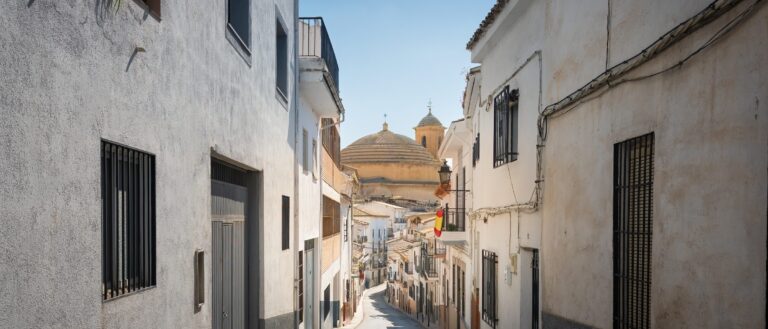 A street in Montefrío with the church of La Encarnación, Granada province