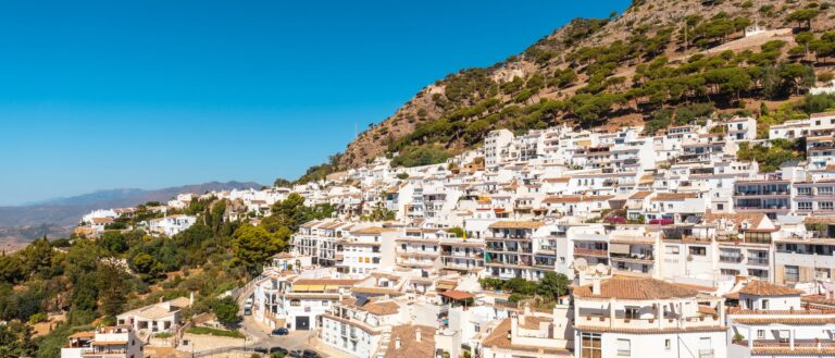 A white village spread across a hillside in Málaga province